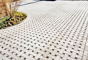 Photo of a large patio walkway that uses pervious pavers in a basket weave pattern